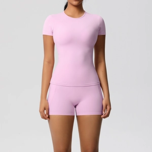 Close-up of light pink high-waisted yoga shorts with functional side pocket detail