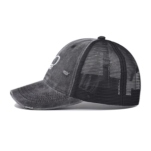 Detail of vintage washed grey trucker hat showing heart embroidery and mesh back
