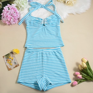 Flat lay of light blue striped knit halter top and matching shorts with floral decor
