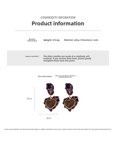 Detail view of vintage heart earrings with crystals and purple resin showing 6cm length