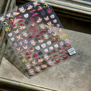 5D embossed nail stickers featuring cute tigers cats and lucky charms on grey background