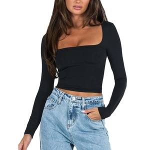 Detail of black long sleeve square neck crop top paired with stylish blue denim jeans