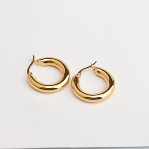 Polished thick gold hoop earrings for women with minimalist French retro aesthetic