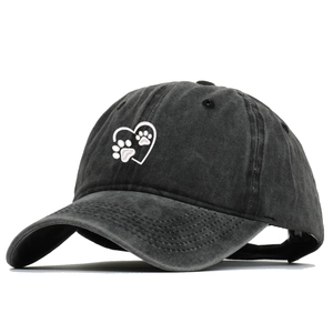 Vintage washed black cotton baseball cap with embroidered heart and paw print pattern