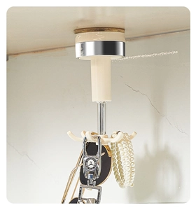 Detail of 360-degree rotating six-claw storage hook in off-white for home organization