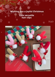 Détail des pinces à cheveux bois de renne avec nœuds écossais pour Noël et fêtes