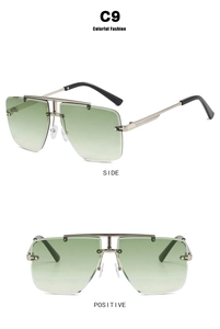 Detail of rimless polygon sunglasses featuring green gradient lenses and metal side arms