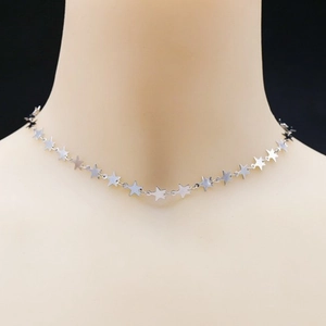 Elegant minimalist silver star pendant necklace displayed on a mannequin for women