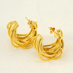 Elegant gold multi-line intertwined hoop earrings with a polished metallic finish
