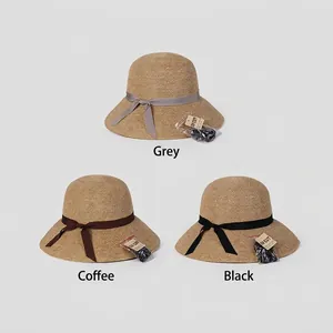 Women's wide brim straw sun hats with elegant ribbon bows and UV protection function