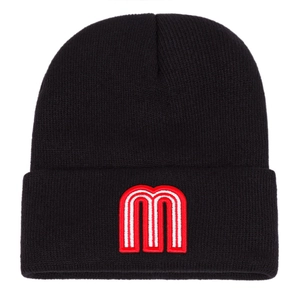 Close-up of the red and white embroidered letter M on a black ribbed knit beanie hat