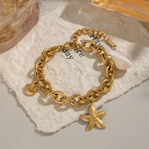 Gold stainless steel bracelet with starfish, seashell charms and white teardrop bead