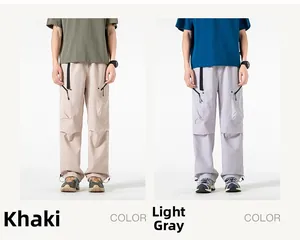 Detail of khaki and light gray cargo pants featuring multi-pockets and drawstring cuffs