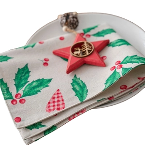 Christmas placemat with red holly berries and reindeer carved star on white background