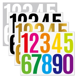 Macro shot of 3-inch waterproof numeric stickers in gold, silver, black and color variants