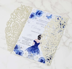 Detailed laser-cut rose invitation cover with floral inner card on marble background