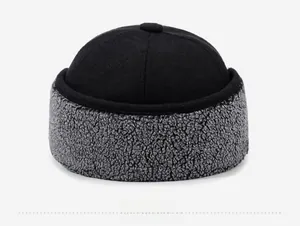 Detail view of the winter cap back showing black fabric and grey faux shearling texture