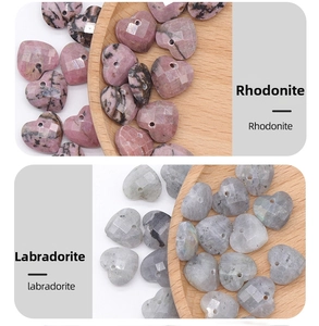 Detailed macro of faceted heart-shaped rhodonite and labradorite stone beads for DIY jewelry