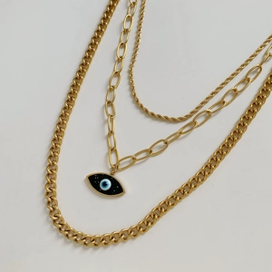 Three-layer gold evil eye pendant necklace featuring paperclip and twist chain links