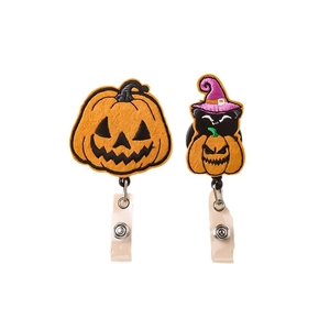 Embroidered Halloween badge reels featuring pumpkin and black cat with witch hat designs