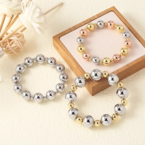 Three-piece beaded ball bracelets set in silver, gold, and rose gold mixed metallic tones