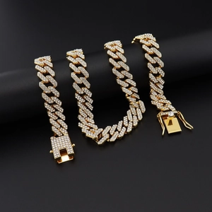 Detail shot of a golden hip-hop Cuban chain necklace with sparkling zircon pave setting