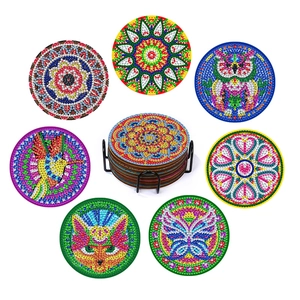 DIY diamond painting coaster set with mandala and animal patterns and a black metal holder