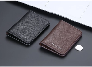 Close-up of slim lychee grain leather wallets in black and brown with neat stitching