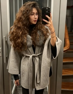Detailed mirror selfie of grey faux fur collar wool coat with stylish waist tie