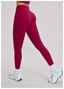 Detailed back view of high-waisted magenta yoga leggings showing flattering fit and seams