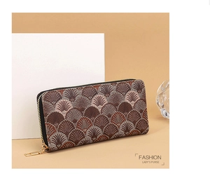 Detail of brown long wallet with embroidered scallop patterns and golden zipper
