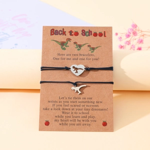 Detail view of heart dinosaur bracelets on a Back to School message card for mother and child