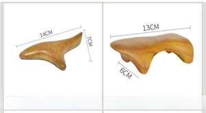 Macro shot of sandalwood gua sha tools with dimensions for triangle and dog-shaped massagers