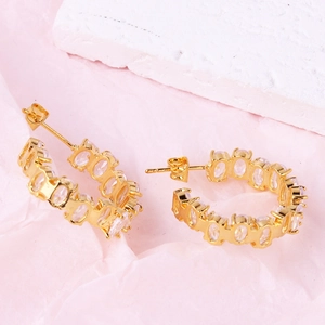 Elegant gold-plated C-shaped hoop earrings with sparkling oval cubic zirconia stones