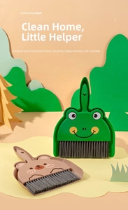 Close-up of mini cartoon frog and bear desk cleaning brush and dustpan set for kids