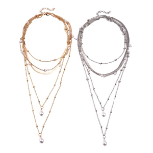 Multi-layer layered necklace with gold and silver finishes and teardrop pearls