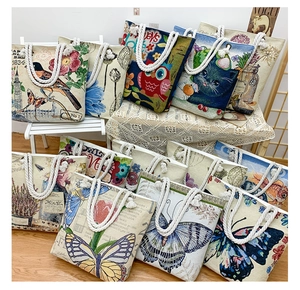 Detailed close-up of colorful jacquard canvas tote bags with thick cotton rope handles