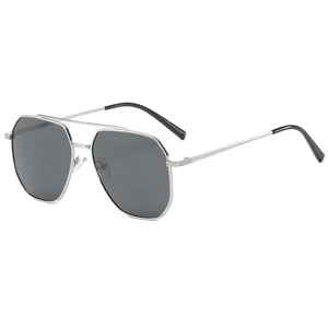 Close-up of silver metal pilot sunglasses with dark gray lenses and slim frame