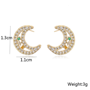 Macro shot of moon-shaped gold earring with zircon stones, showing size 1.3cm by 1.1cm