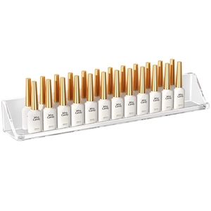 Clear acrylic wall-mounted nail polish display shelf with multiple rows for organization