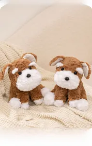 Close-up of plush Schnauzer puppy dolls with realistic brown and white fur textures