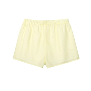 Close-up of yellow and white striped shorts with elastic waistband and high-quality fabric