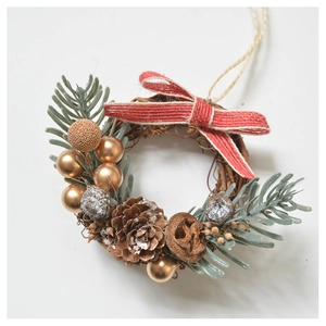 Close-up of Christmas mini wreath with natural pine cones, red bow and gold bells