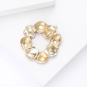 Back view of gold strawberry wreath brooch showing durable alloy pin clasp mechanism