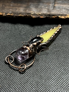 Detailed copper wire wrapped pendant with raw amethyst and vintage agate stone