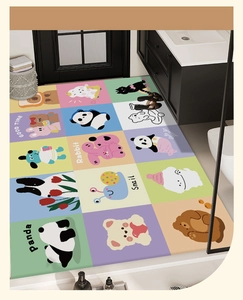 Detail of multi-color bathroom mat showing cute cartoon animal patterns and grid textures