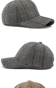 Detail showing high-quality tweed texture and check pattern on stylish baseball caps