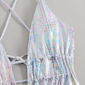 Macro detail of holographic laser swimsuit showing snakeskin texture and side lacing