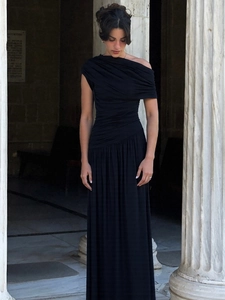 Elegant black off-shoulder maxi dress with pleated details and a flowing silhouette