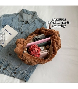 Top view of spacious brown quilted velvet tote bag interior showing large capacity for items